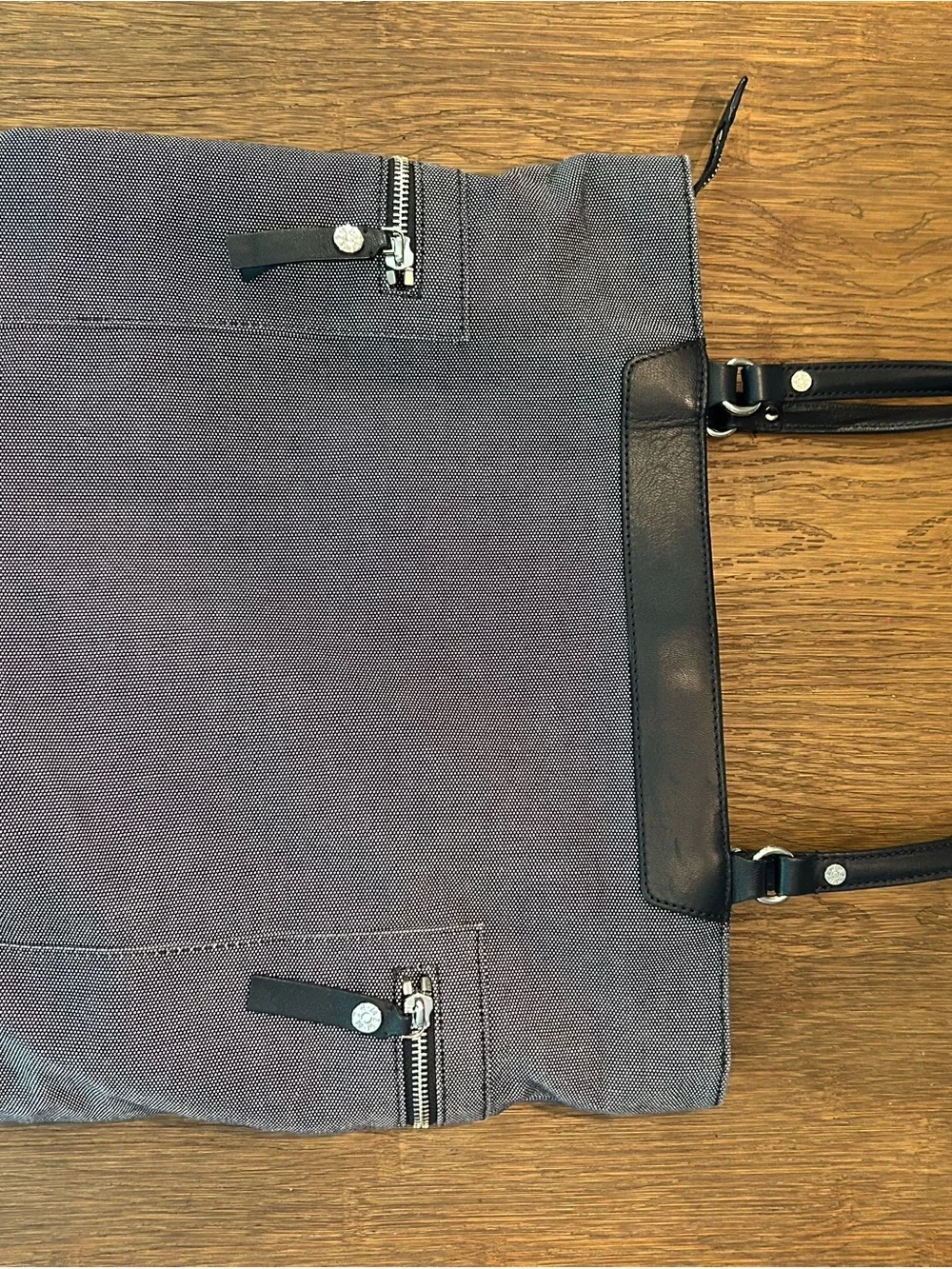 MZ Wallace navy canvas tote with leather pocket and handles